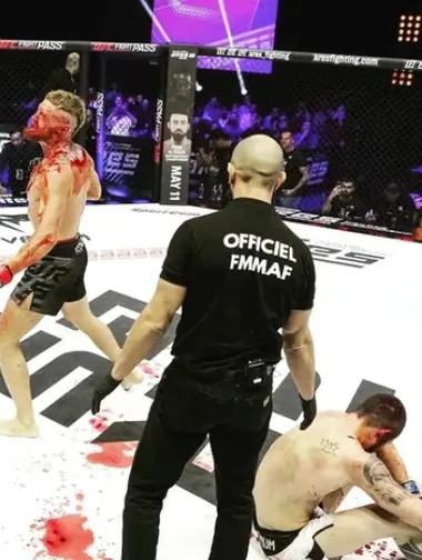 Ares Fighting Championship canvas on fight night — custom octagon floor with sponsor branding